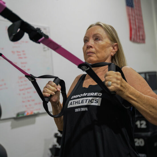 Woman working out at Empowered Athletics Tampa